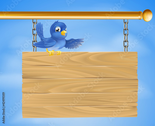 Blue bird on wooden sign