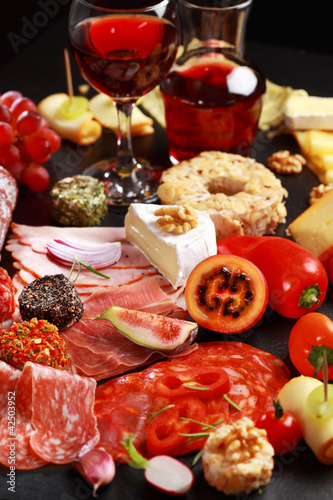 Antipasto catering platter with red wine