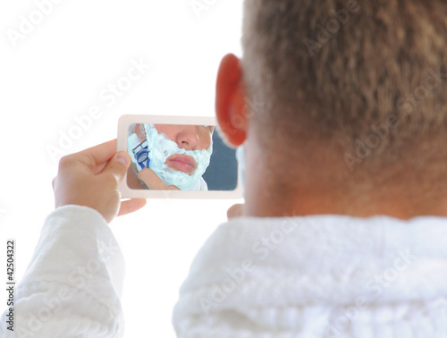 Young man shaving