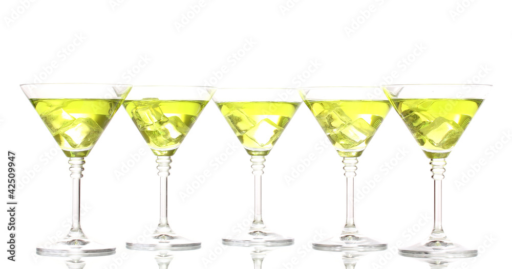 Yellow cocktail in martini glasses isolated on white Yellow cocktail in martini glasses isolated on white