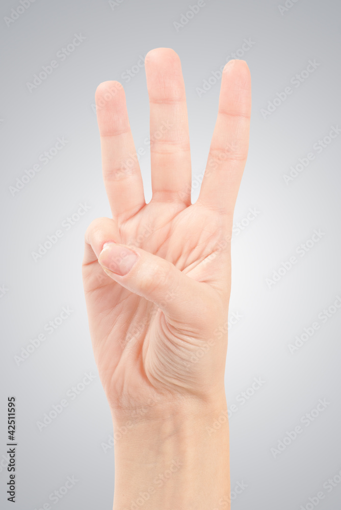 Female hands counting number three isolated on white Female hands counting number three isolated on white