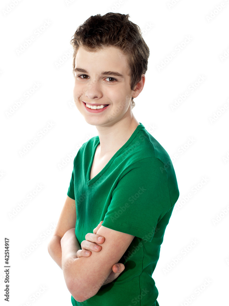 Young boy posing with folded arms Young boy posing with folded arms