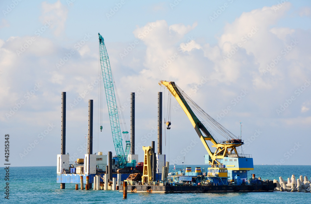Port cranes work on building of a new pier in sea port of Sochi Port cranes work on building of a new pier in sea port of Sochi