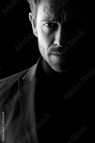 Low key portrait of mid age man