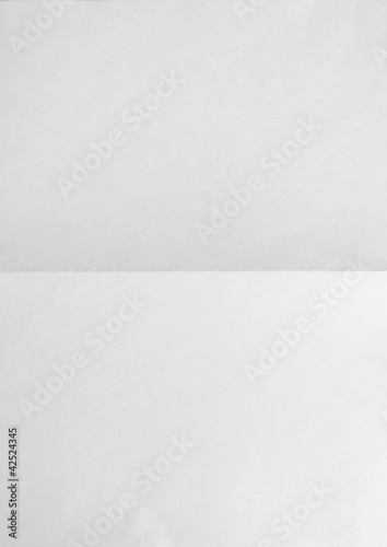 white sheet of paper folded on two. vertical view