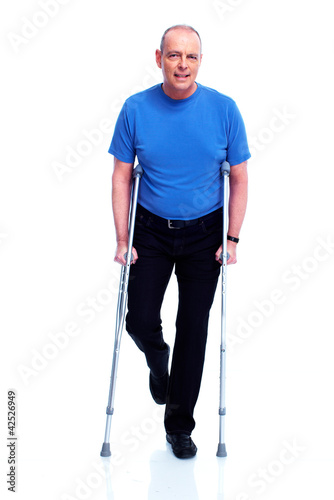 Man with crutch. © grinny