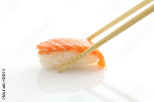 Salmon sushi with chopsticks