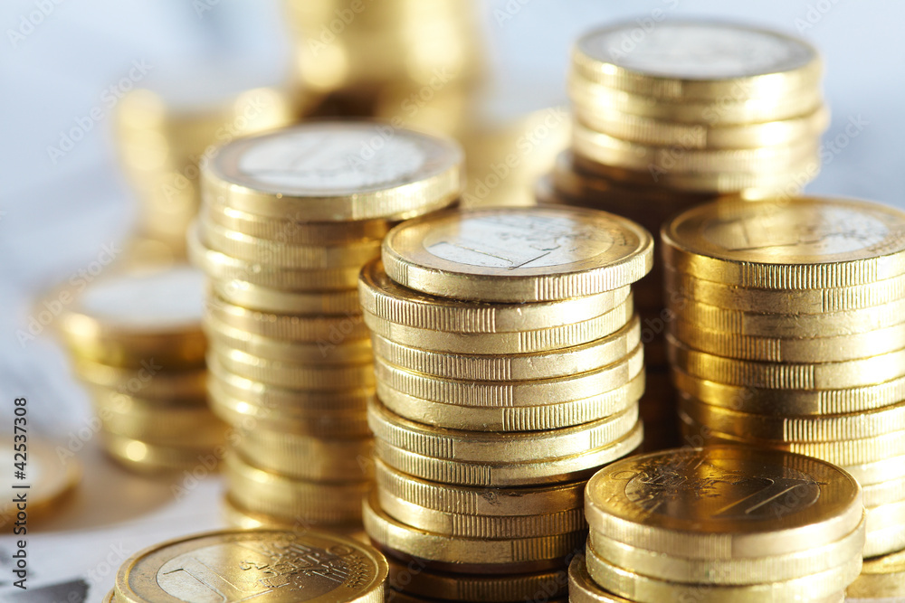 Business diagram on financial report with coins Business diagram on financial report with coins