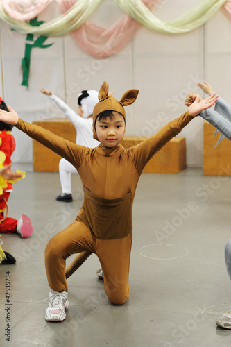 Asian kid performing
