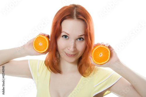 Young woman with oranges