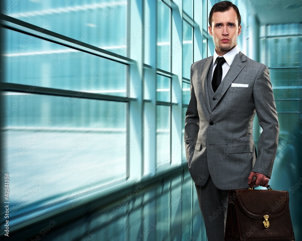 Businessman inside modern building Businessman inside modern building