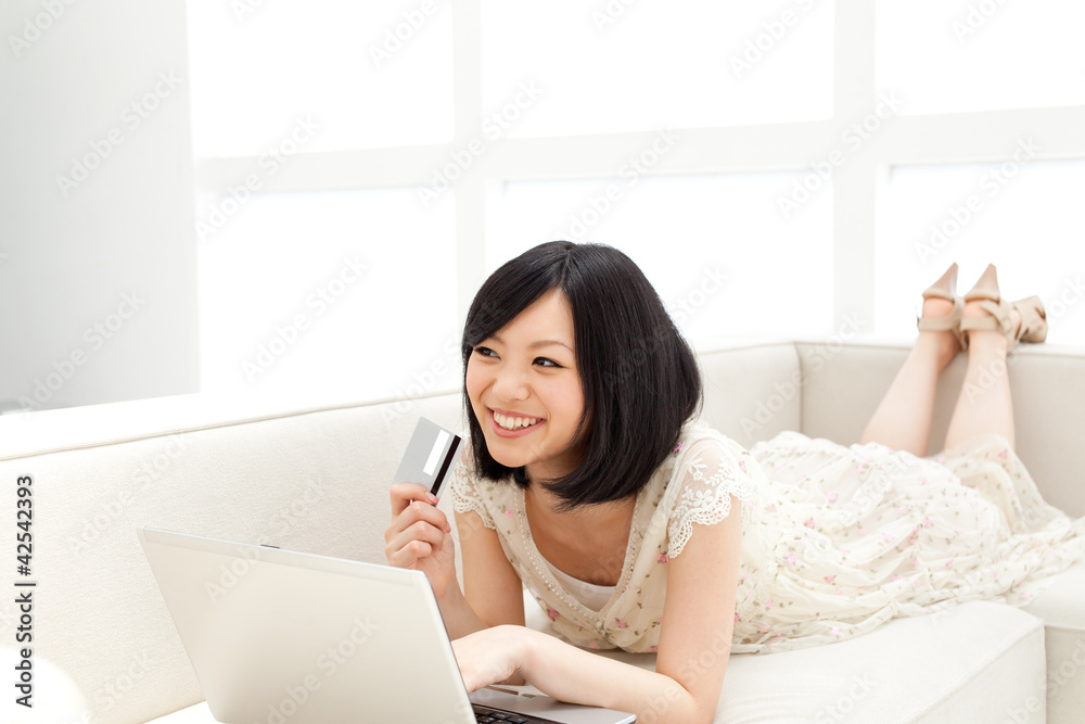 Beautiful young woman using a laptop computer. Portrait of asian Beautiful young woman using a laptop computer. Portrait of asian