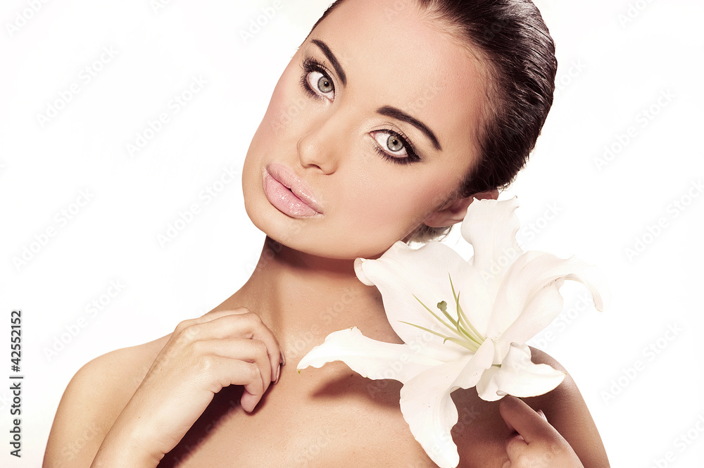 Portrait of a beautiful woman with a flower