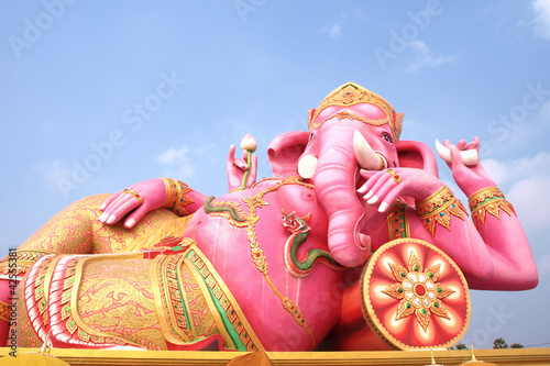 Big pink Ganesha in relaxed pose, From temple in Thailand