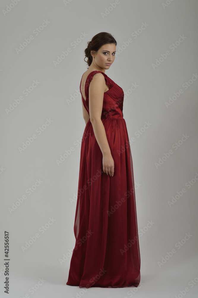 elegant woman in fashionable dress posing in the studio elegant woman in fashionable dress posing in the studio