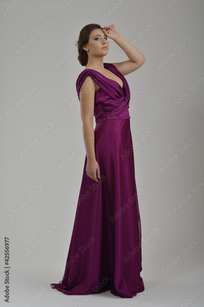 elegant woman in fashionable dress posing in the studio elegant woman in fashionable dress posing in the studio