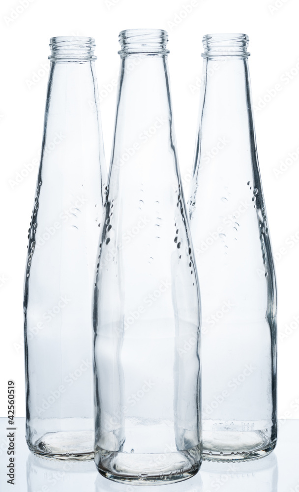 Three empty bottles on a white background. Three empty bottles on a white background.