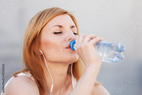 Young woman drinking water