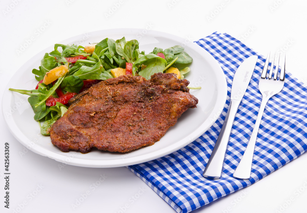 cervical chop with apricot-rocket salad