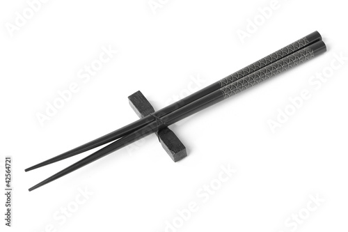 Two black chopsticks isolated