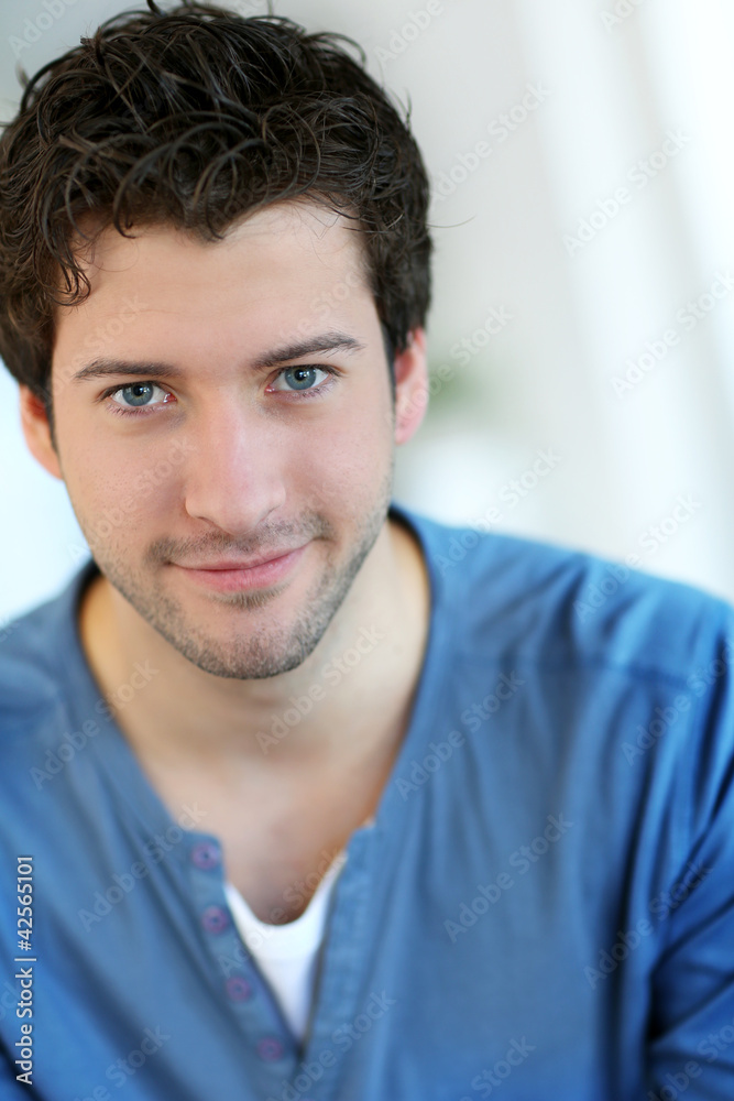 Portrait of cheerful young guy with blue eyes Portrait of cheerful young guy with blue eyes