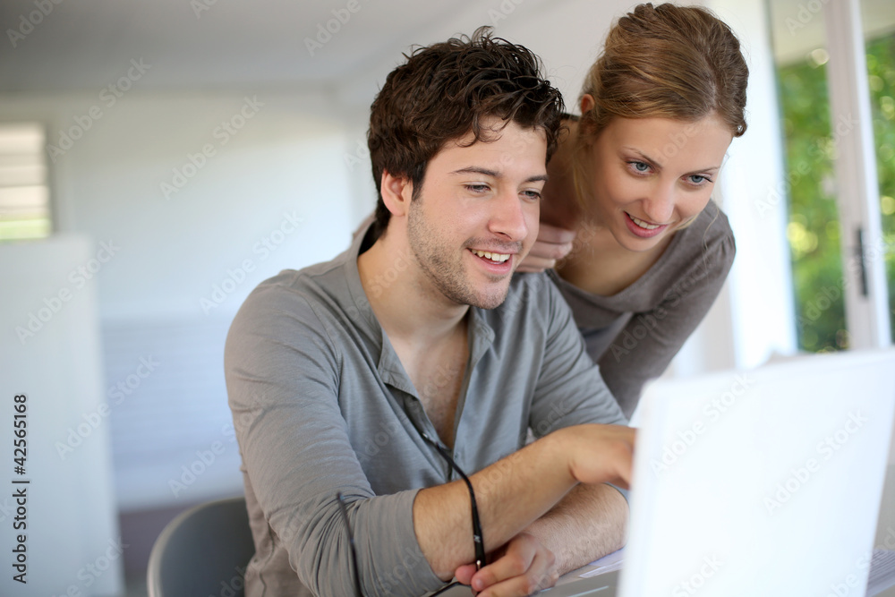 Young people studying from home with laptop computer Young people studying from home with laptop computer