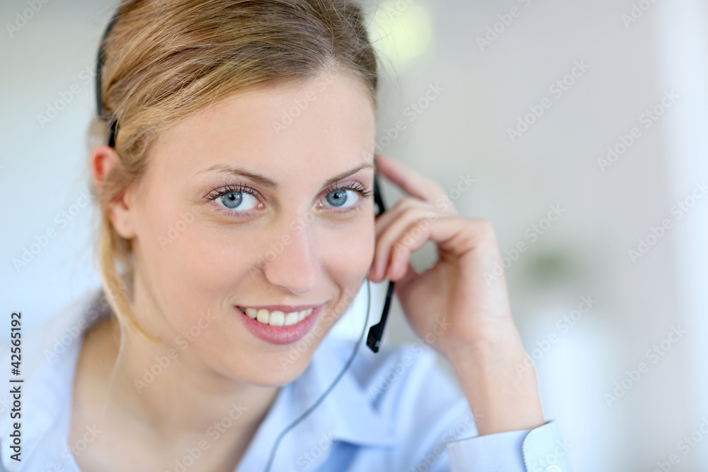 Closeup of attractive blond customer service assistant Closeup of attractive blond customer service assistant