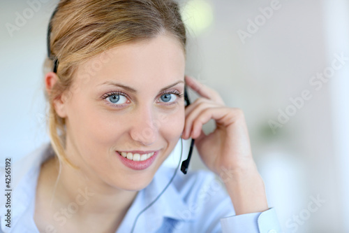 Closeup of attractive blond customer service assistant