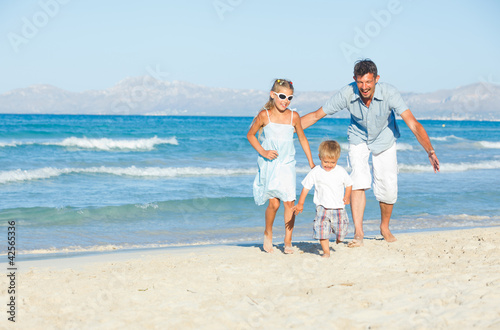 Happy family on tropical beach