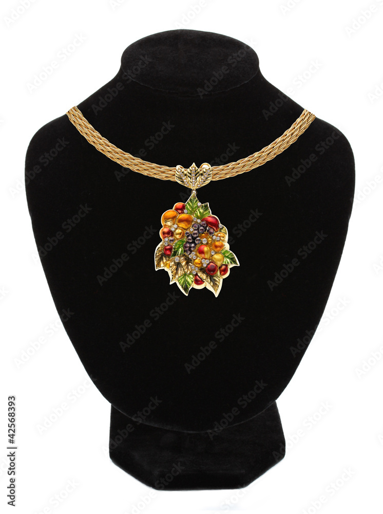 Pendant with colorful gem on mannequin isolated on white Pendant with colorful gem on mannequin isolated on white