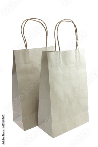 A plain brown paper gift bag isolated on white background