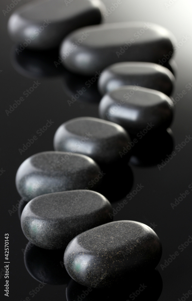 Spa stones on grey background