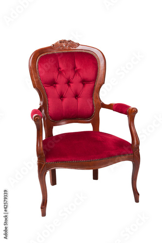 A red ancient armchair on a white background