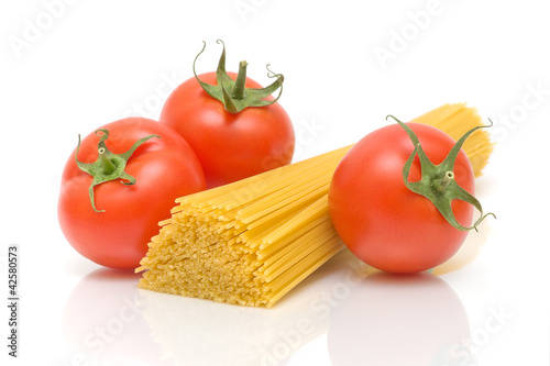 tomatoes and pasta closeup on white background