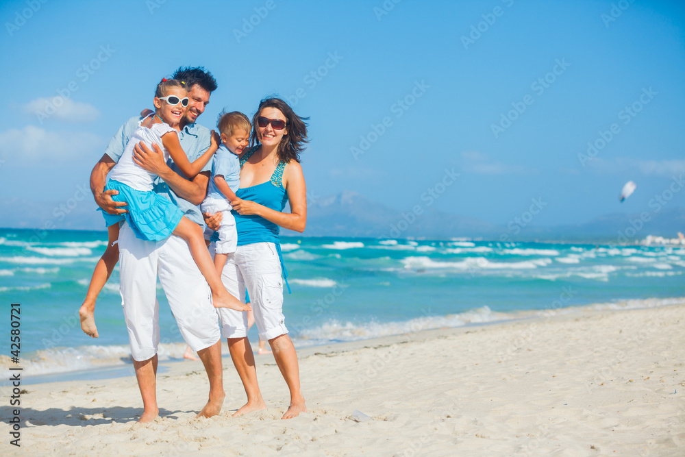 Family having fun on tropical beach