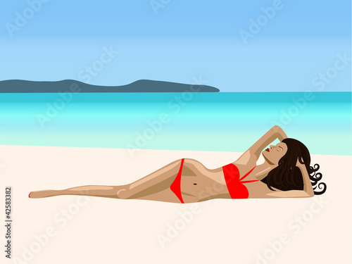 A  girl is lying on a beach