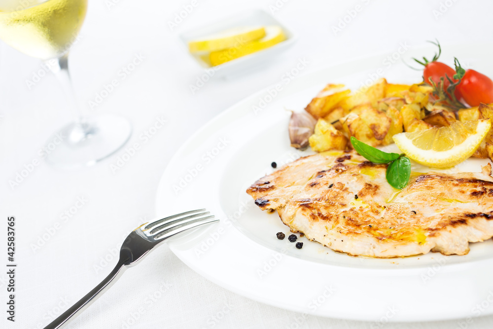 Chicken breast grilled with potatoes, tomatoes and spice Chicken breast grilled with potatoes, tomatoes and spice