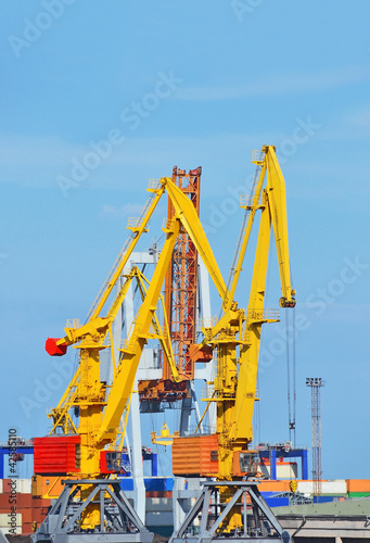 Container stack under crane bridge in port