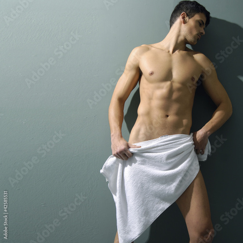 muscular sexy man covered with the towel