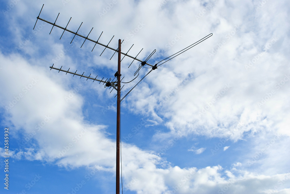 Home advance TV antenna on blue sky Home advance TV antenna on blue sky