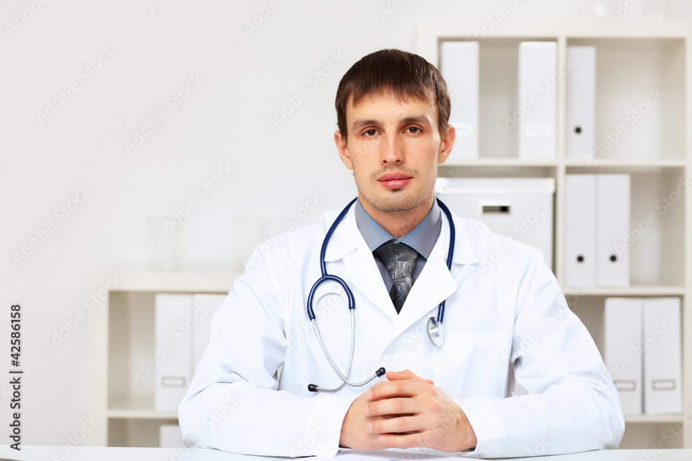 Young male doctor in white uniform Young male doctor in white uniform