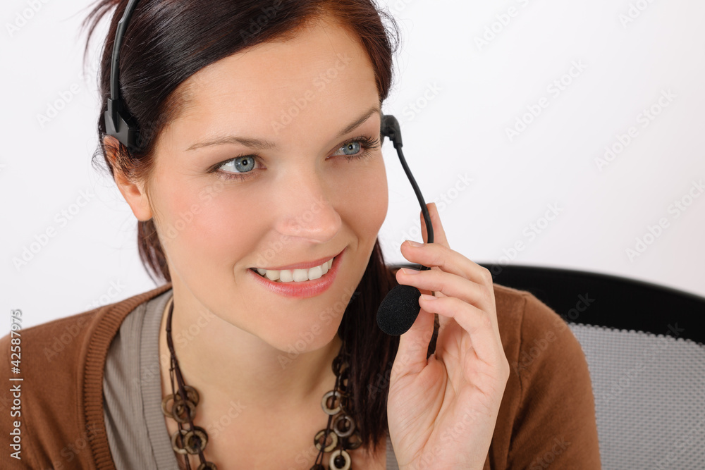 Friendly help desk woman smiling Friendly help desk woman smiling