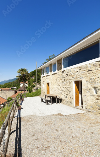 holiday home in the mountain, outdoor view, stone facade photo