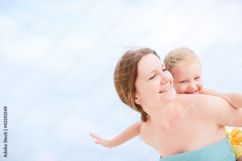 Mother and daughter having fun outdoors