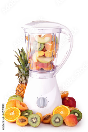 blender with assortment of fruits