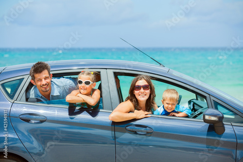 Family of four driving in a car