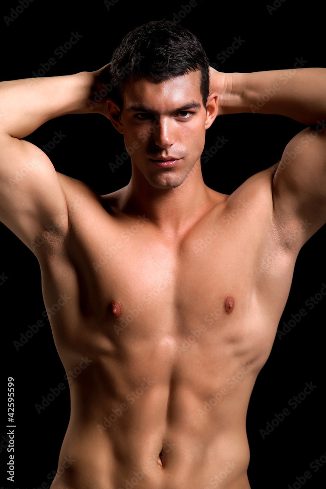 Healthy muscular young man. Isolated on black background. Healthy muscular young man. Isolated on black background.