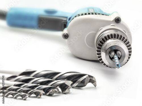 Obraz na płótnie Drill and drill bits, selective focus, on white background