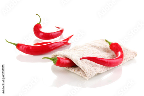 Red hot chili peppers in bag isolated on white