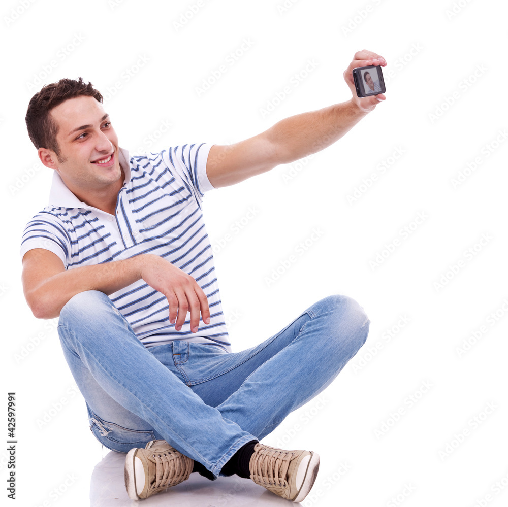 man taking a picture of him self with phone man taking a picture of him self with phone